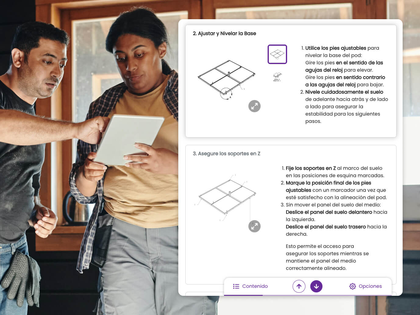 Dos instaladores revisan las instrucciones digitales en español en una tableta.
